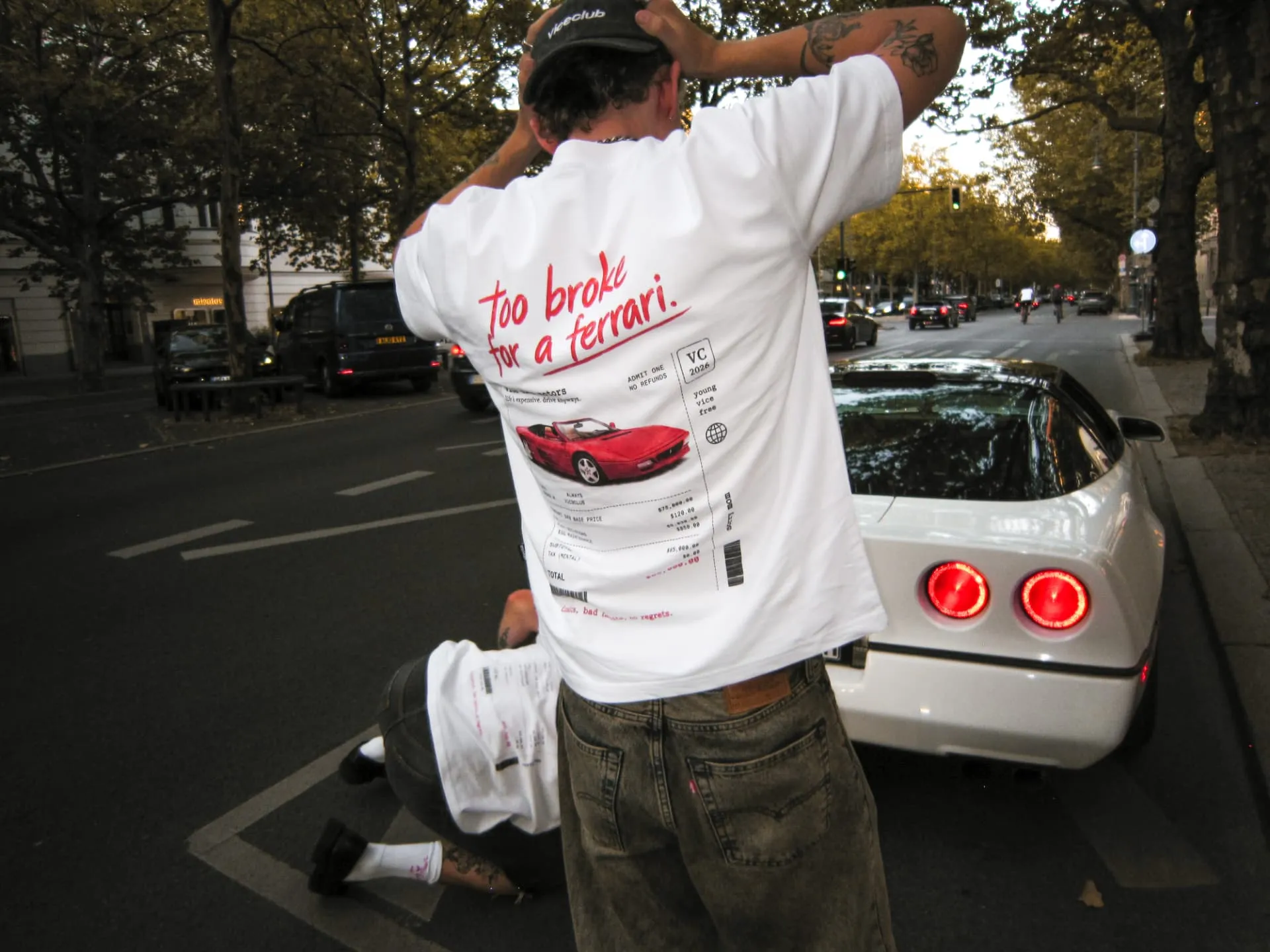 too broke for a ferrari tee back print next to a corvette